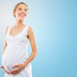 Portrait of the young happy smiling pregnant woman